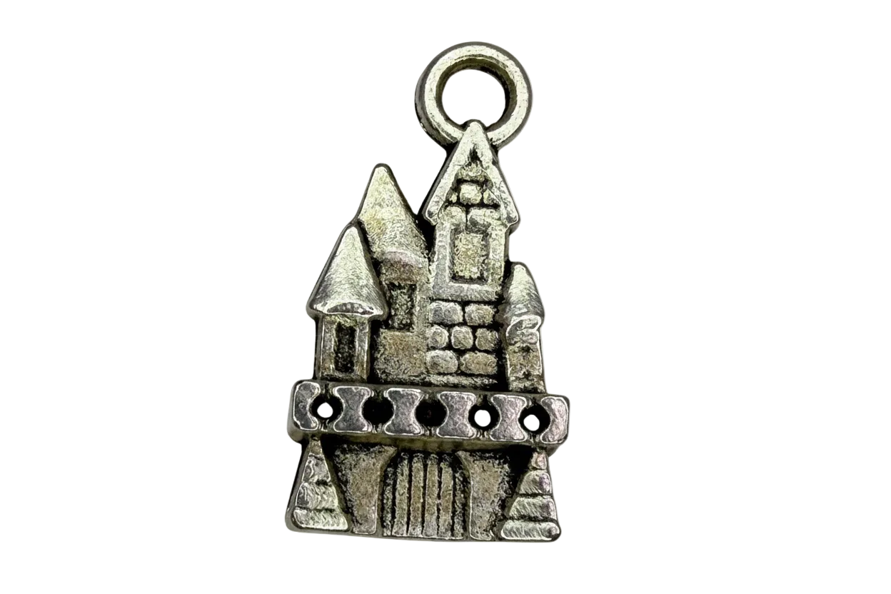 Antiqued silver castle silhouette charm with tower and stonework details