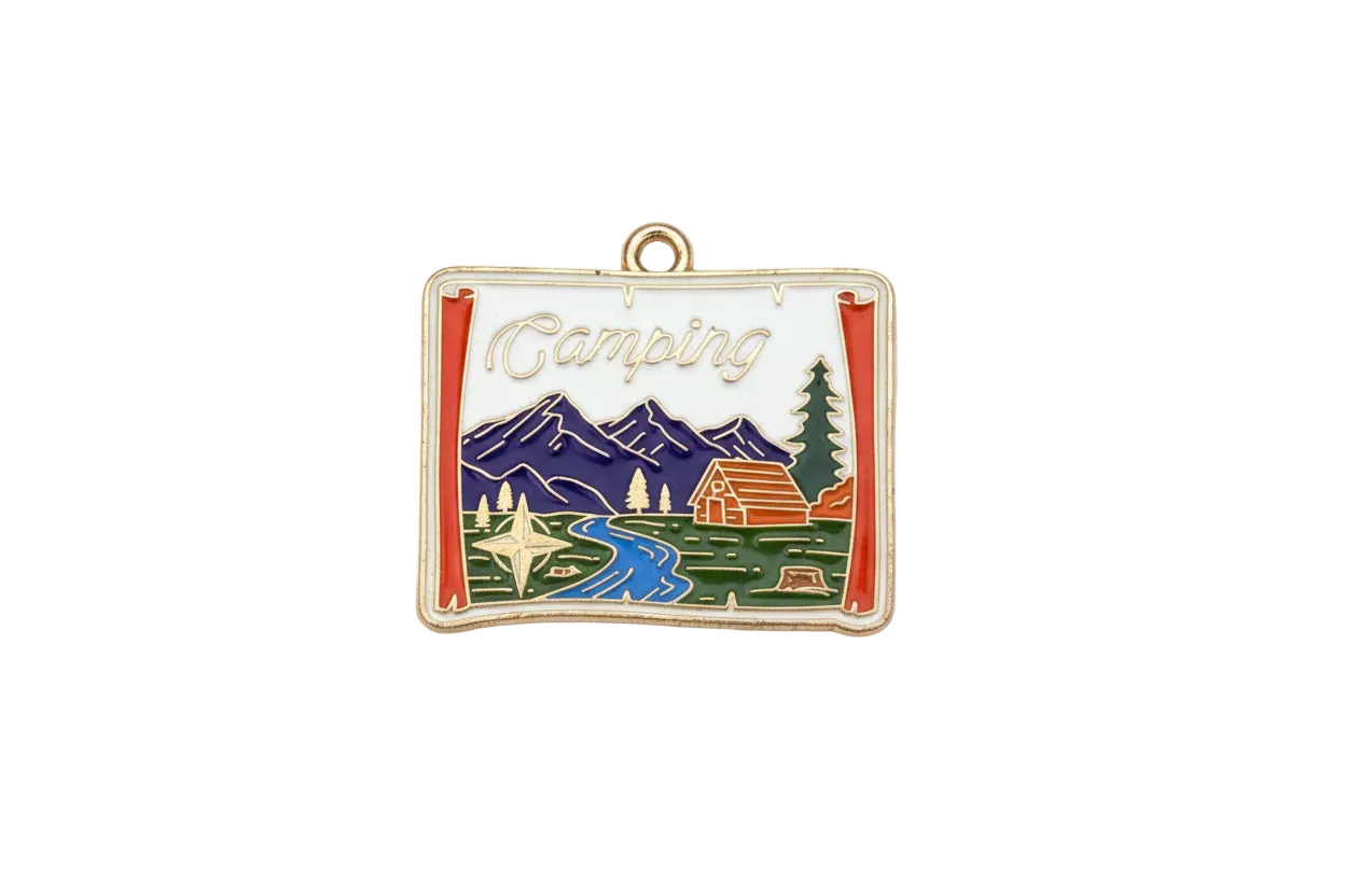 Gold-tone postcard pendant with enamel camping scene, mountains, river, cabin, and “Camping” script