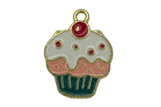 Gold-outlined cupcake charm with white icing, pink frosting, teal wrapper, and red cherry top