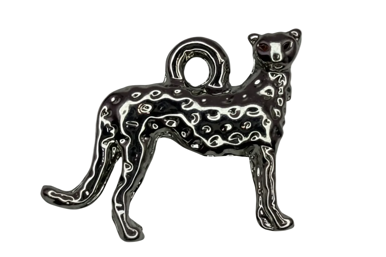 Black enamel spotted leopard cat figure with silver outlining and a small red eye accent