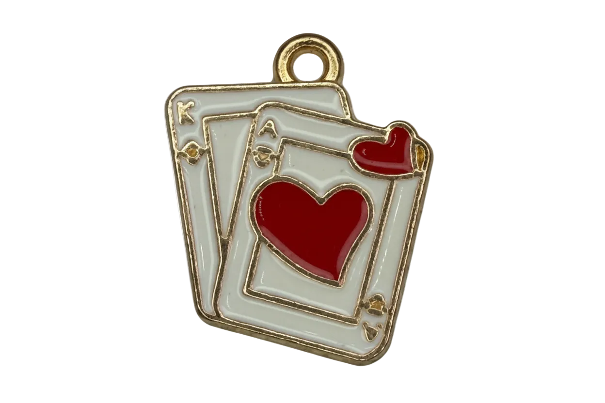 White enamel playing card stack with gold outline and red heart details on black background