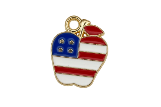 Gold-outlined enamel apple with red and white stripes, blue star panel, and red leaf
