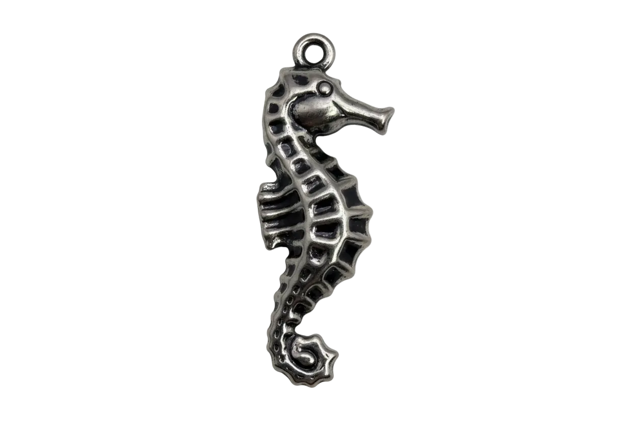 Antique silver seahorse pendant with textured ridges and darkened details