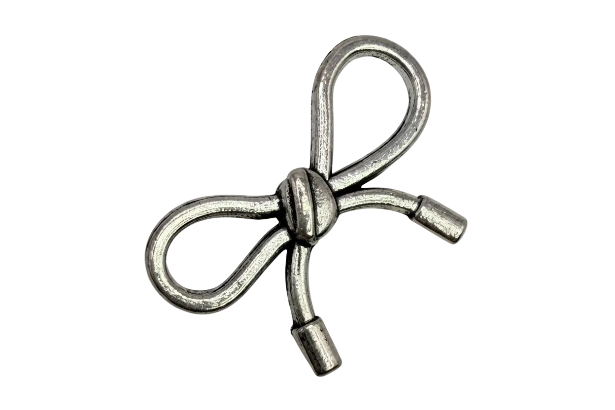 Antiqued silver ribbon bow with sculpted knot detail on black background
