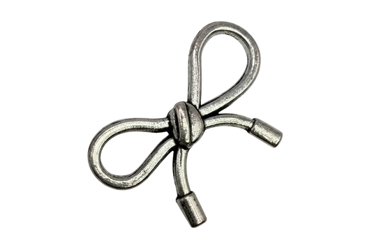 Antiqued silver ribbon bow with sculpted knot detail on black background
