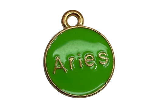 Green round enamel Aries disc with raised gold lettering and gold border