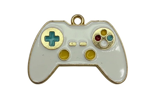 White enamel game controller charm with gold trim and multicolor buttons