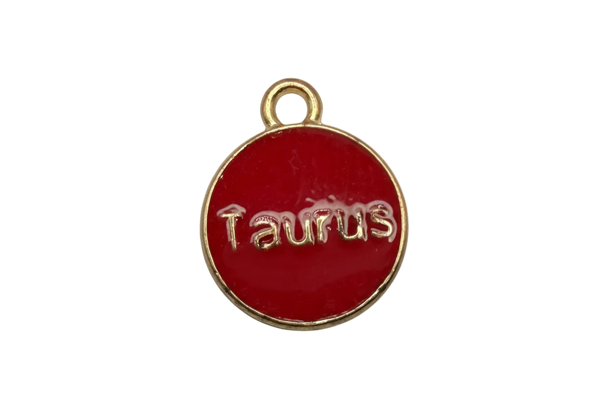 Glossy red round disk with raised gold Taurus lettering and gold rim