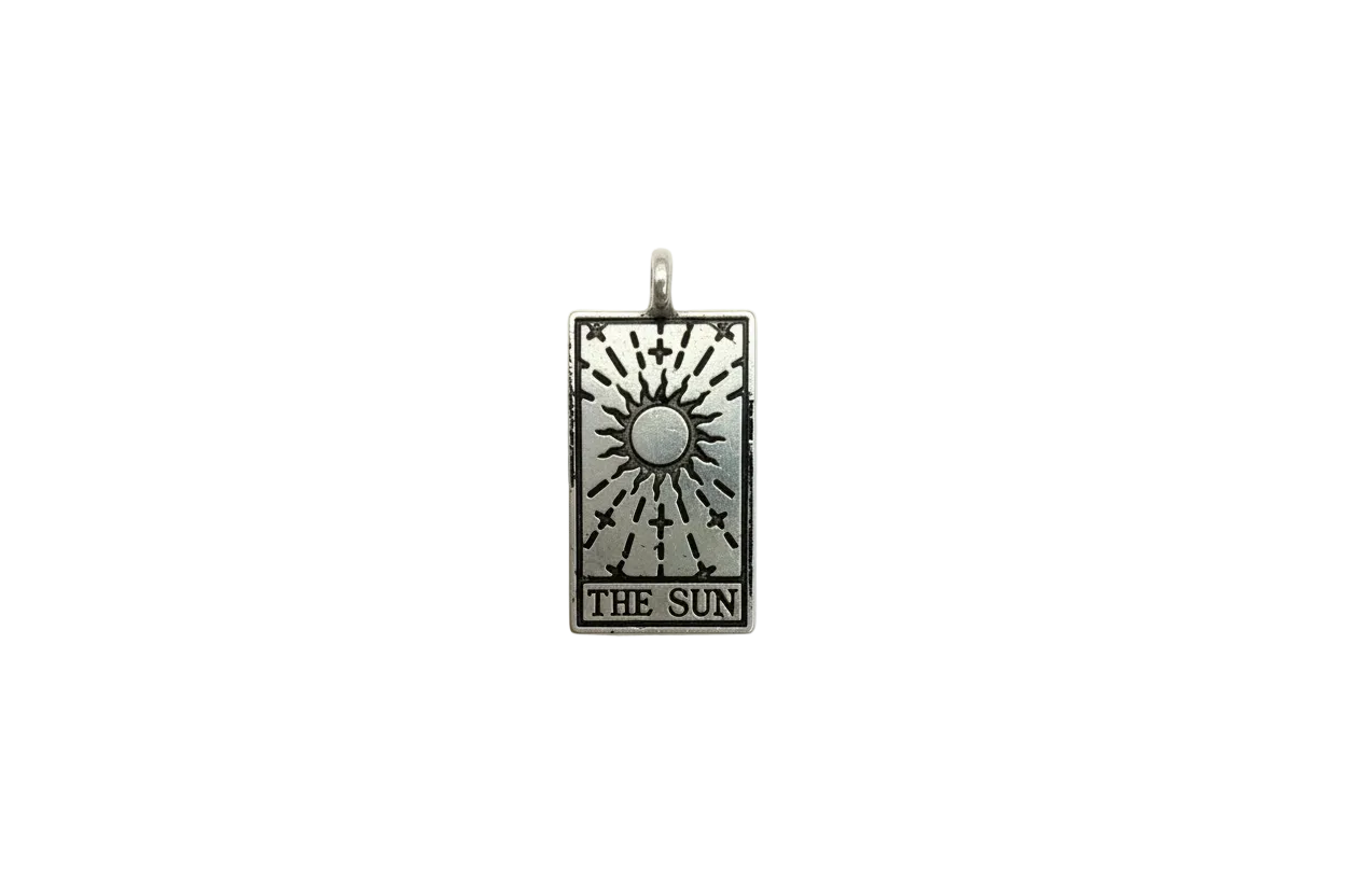 Silver-tone tarot sun card with etched rays and "THE SUN" text