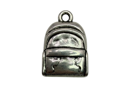 Silver mini backpack pendant with raised pocket and panel details on black background