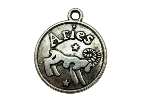 Antique silver round Aries zodiac medallion with ram silhouette and star accents