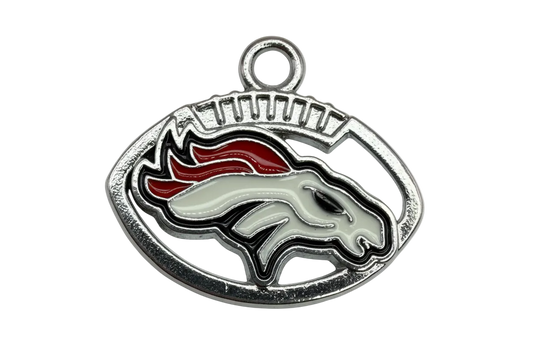Oval silver enamel horse head football emblem with white horse and red-orange mane on black
