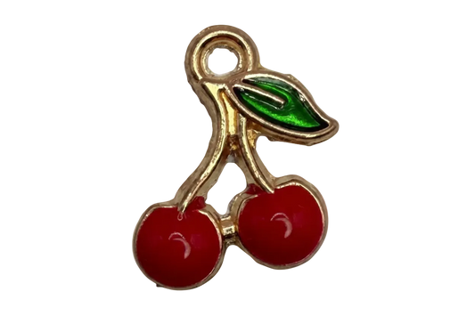 Gold-outlined cherry pair with glossy red enamel fruit and a green leaf