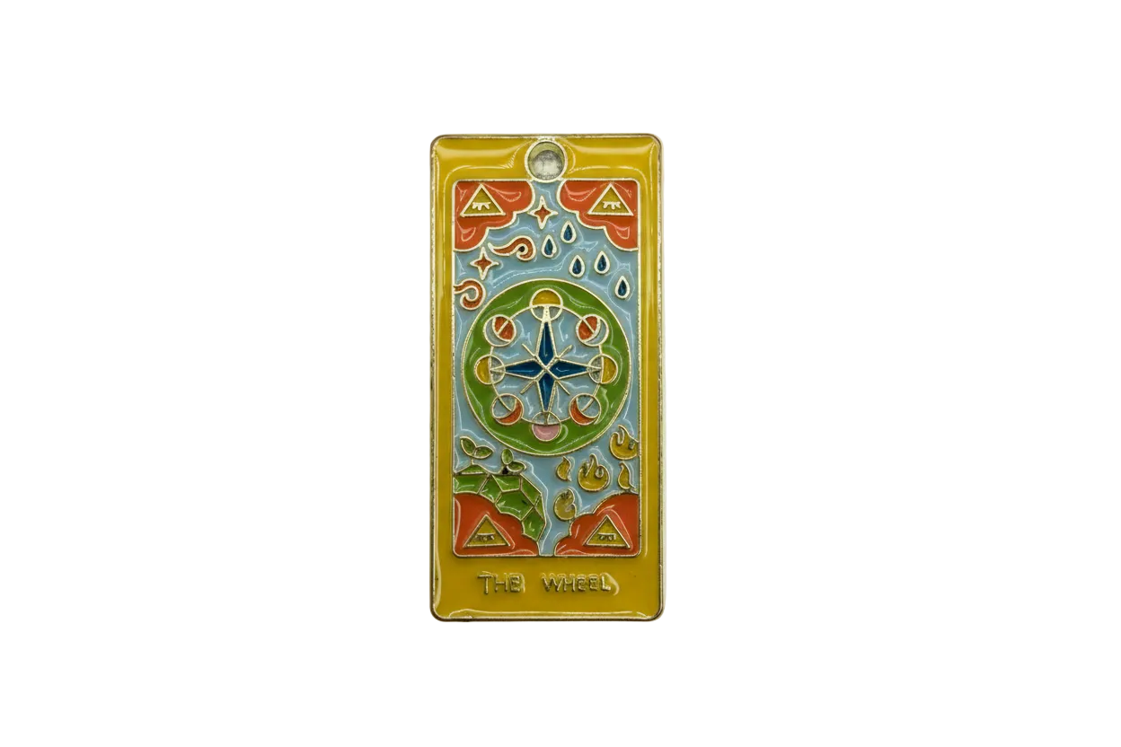 Gold rectangular tarot card charm with colorful enamel wheel motif and “THE WHEEL” text