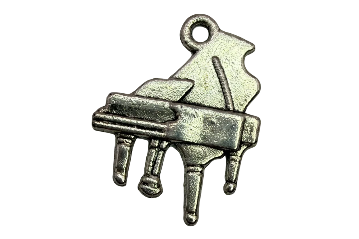 Antique silver grand piano pendant with raised details