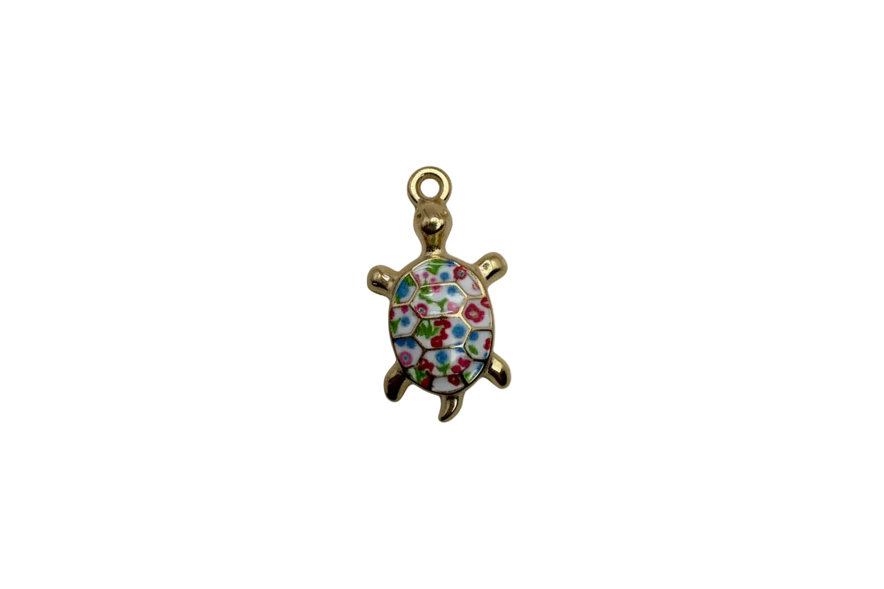 Gold turtle with white floral enamel shell