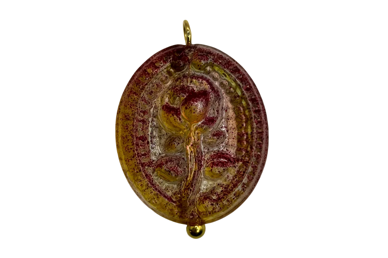 Oval cameo medallion in marbled burgundy and amber tones with gold-colored details