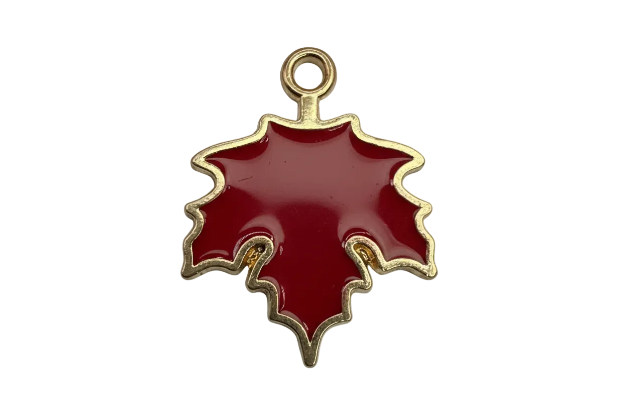Glossy red enamel maple leaf with gold outline