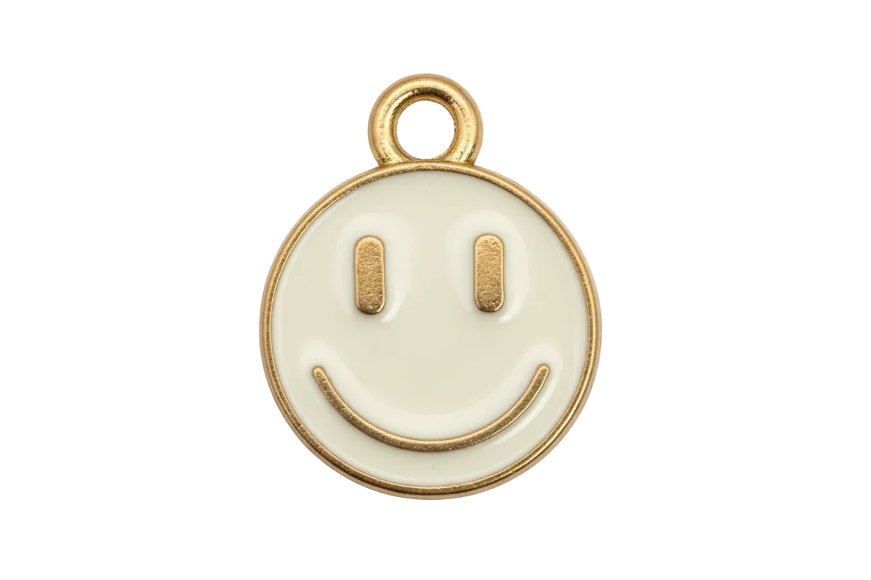 White enamel round smiley face disc with gold outline and loop top