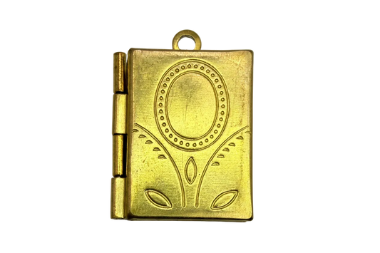 Gold rectangular book locket with embossed oval frame and floral engraving