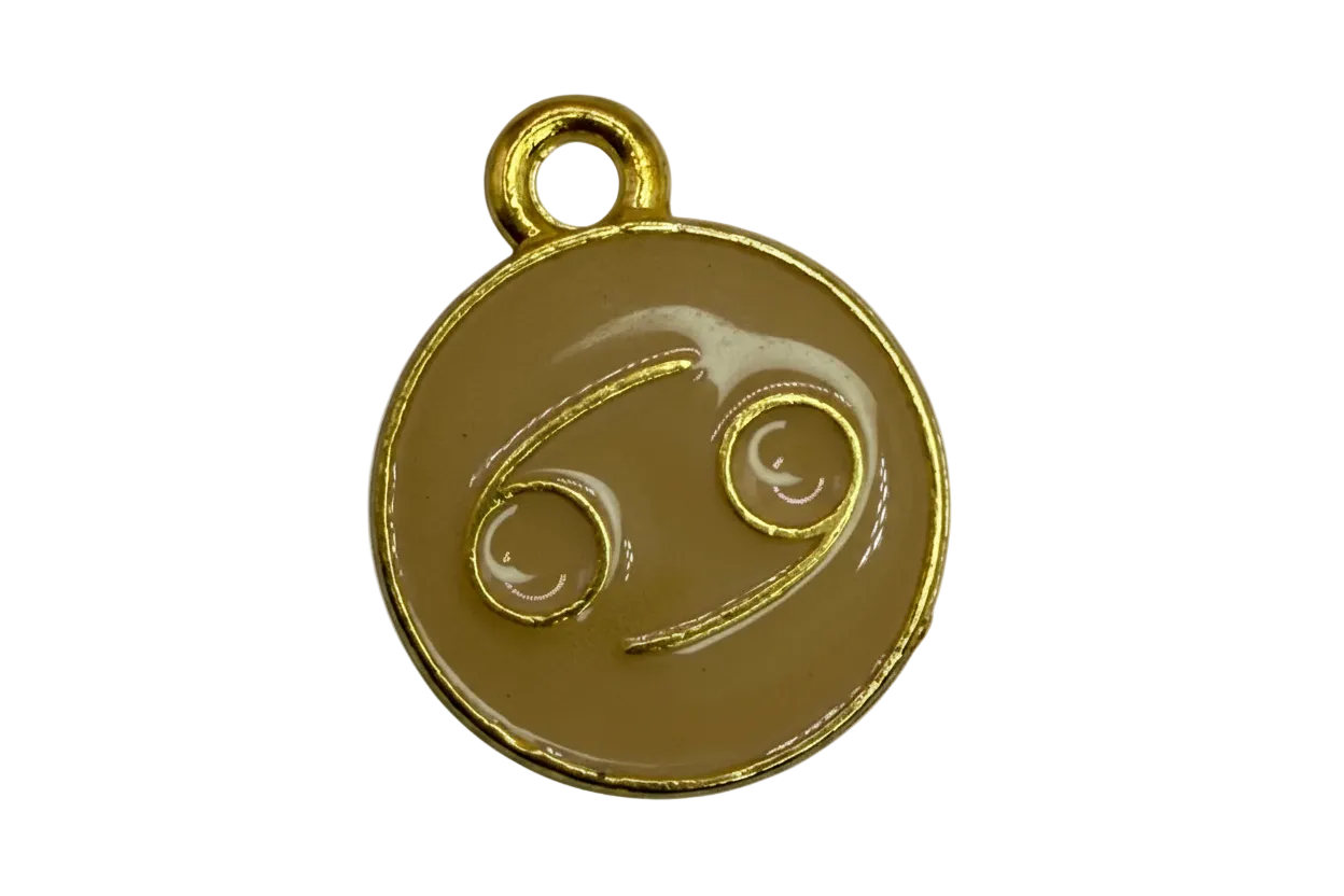 Tan enamel round disc with gold outline and Cancer zodiac symbol