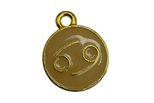 Tan enamel round disc with gold outline and Cancer zodiac symbol
