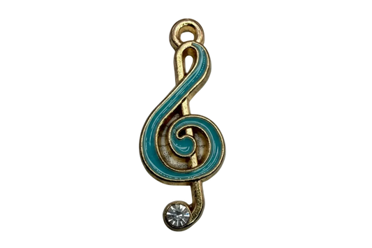 Gold treble clef note with teal enamel and a clear crystal accent