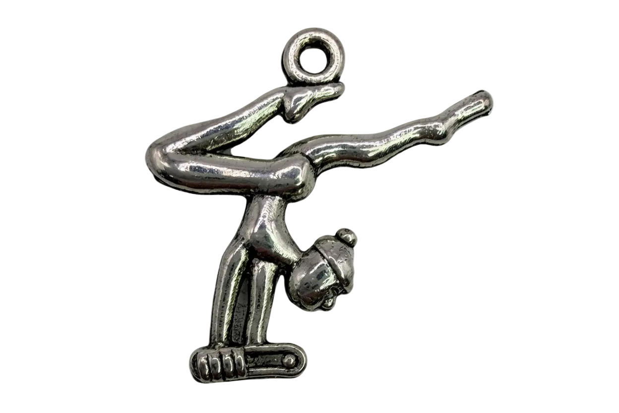 Polished silver gymnast figure in an inverted pose with sculpted details