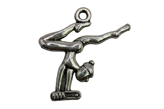 Polished silver gymnast figure in an inverted pose with sculpted details