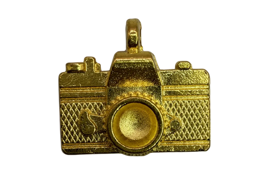 Gold camera charm with textured body and raised circular lens