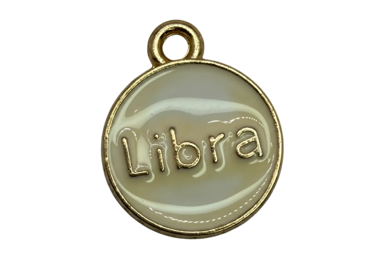 Ivory enamel round disc with raised Libra lettering and gold border