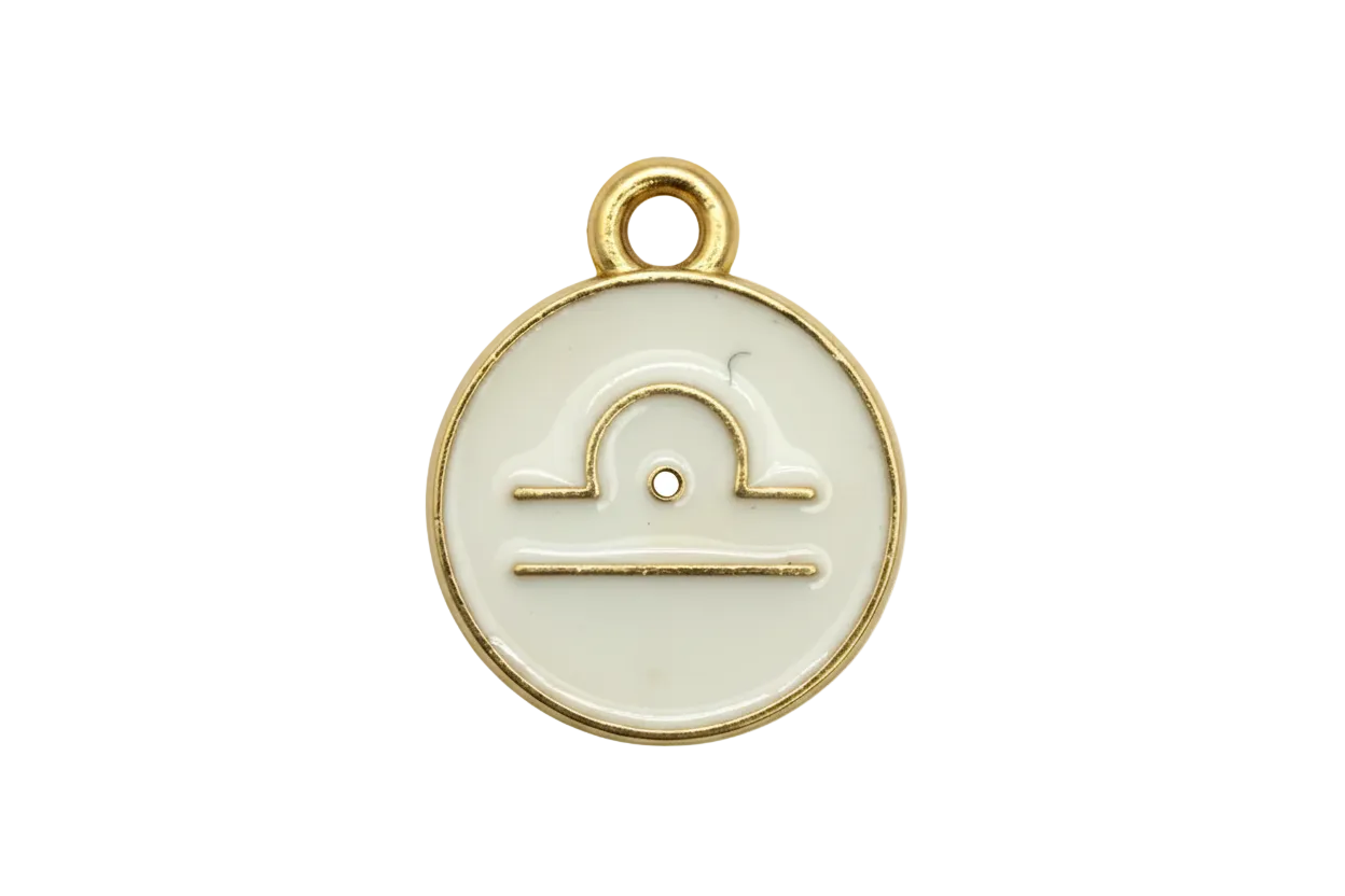 Round ivory enamel Libra zodiac disc with gold outline and scales symbol