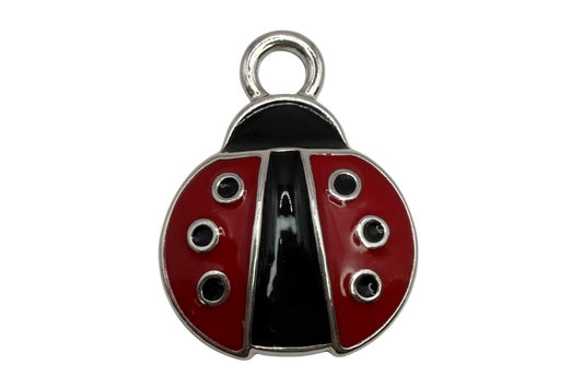 Red and black enamel ladybug charm with silver outline and spot details