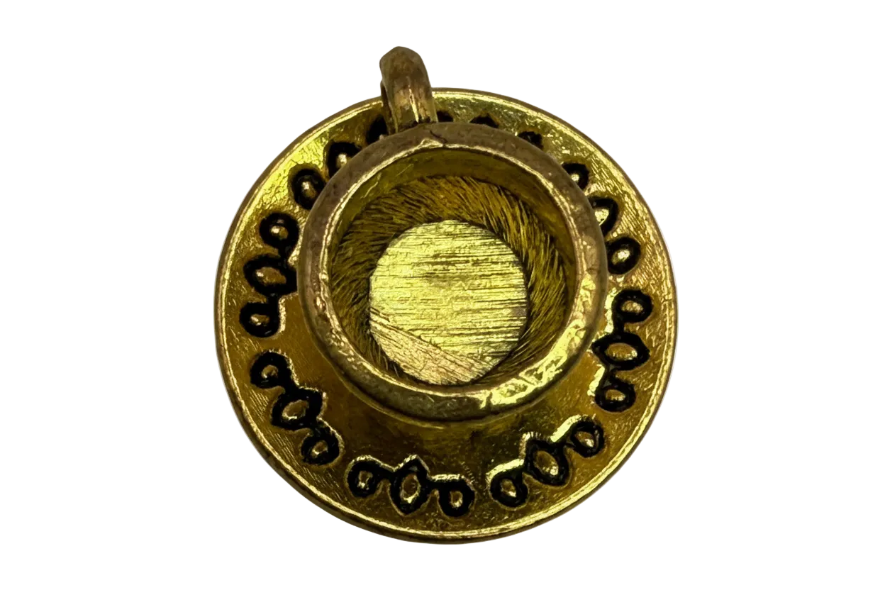 Gold round medallion with raised brushed center and black inlaid rim details
