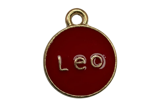 Red enamel round disc with raised Leo lettering and gold edge