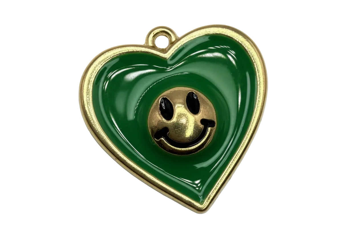 Glossy green heart with gold outline, raised smiley face center, and small clear crystal accent