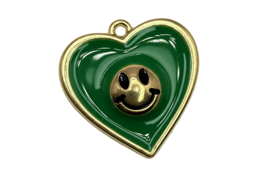 Glossy green heart with gold outline, raised smiley face center, and small clear crystal accent