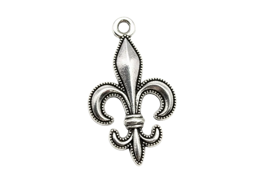Ornate antique silver fleur-de-lis emblem with beaded edging and oxidized details