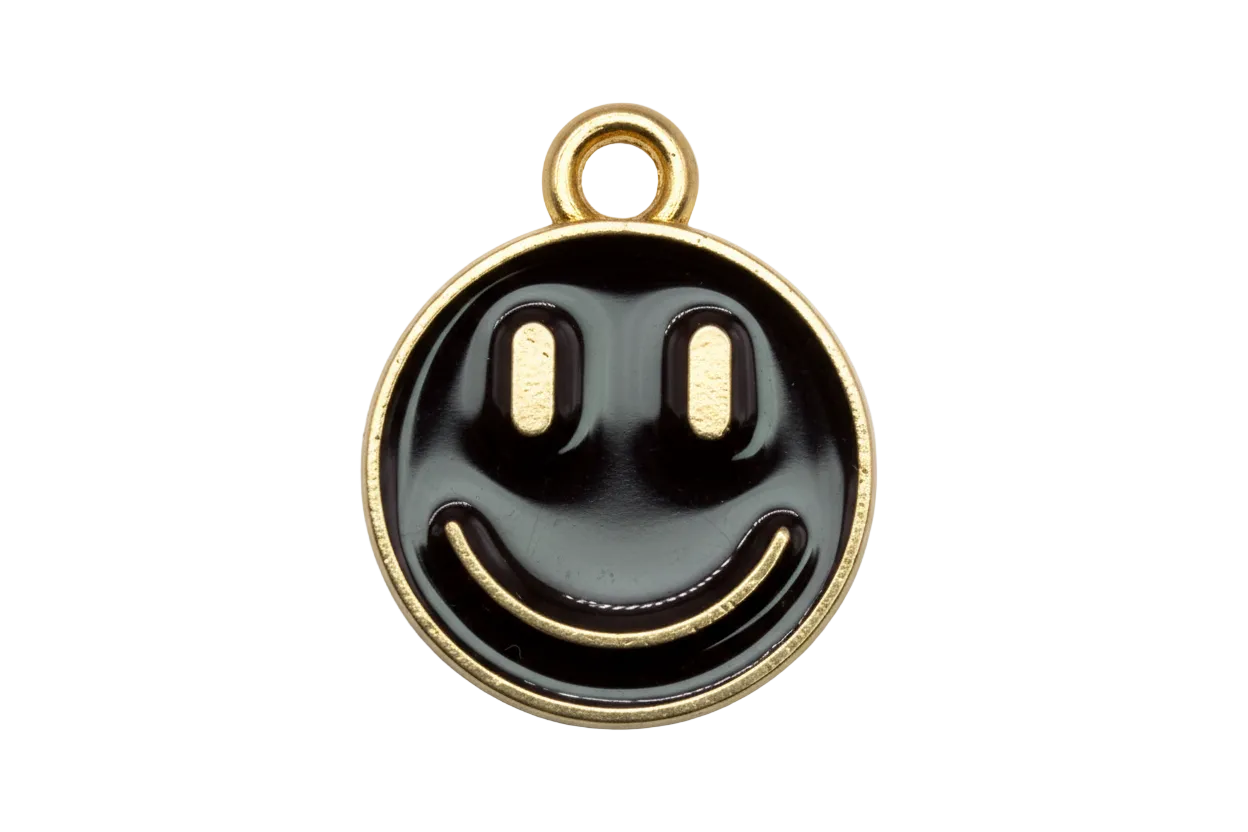 Round black enamel smiley face disc with gold outline and pale blue accents
