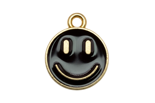 Round black enamel smiley face disc with gold outline and pale blue accents