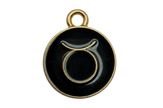 Round black enamel Taurus zodiac disc with gold outline and symbol