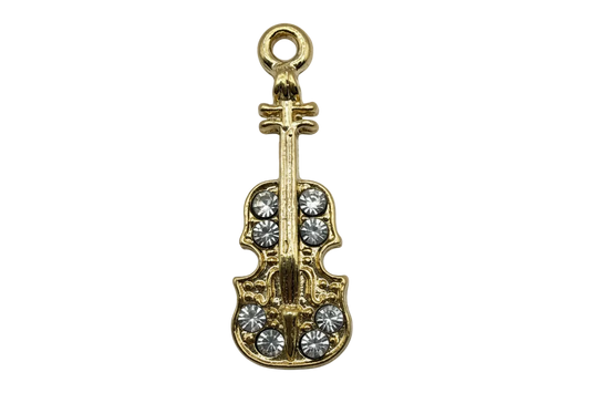 Gold violin charm with clear crystal accents on black background