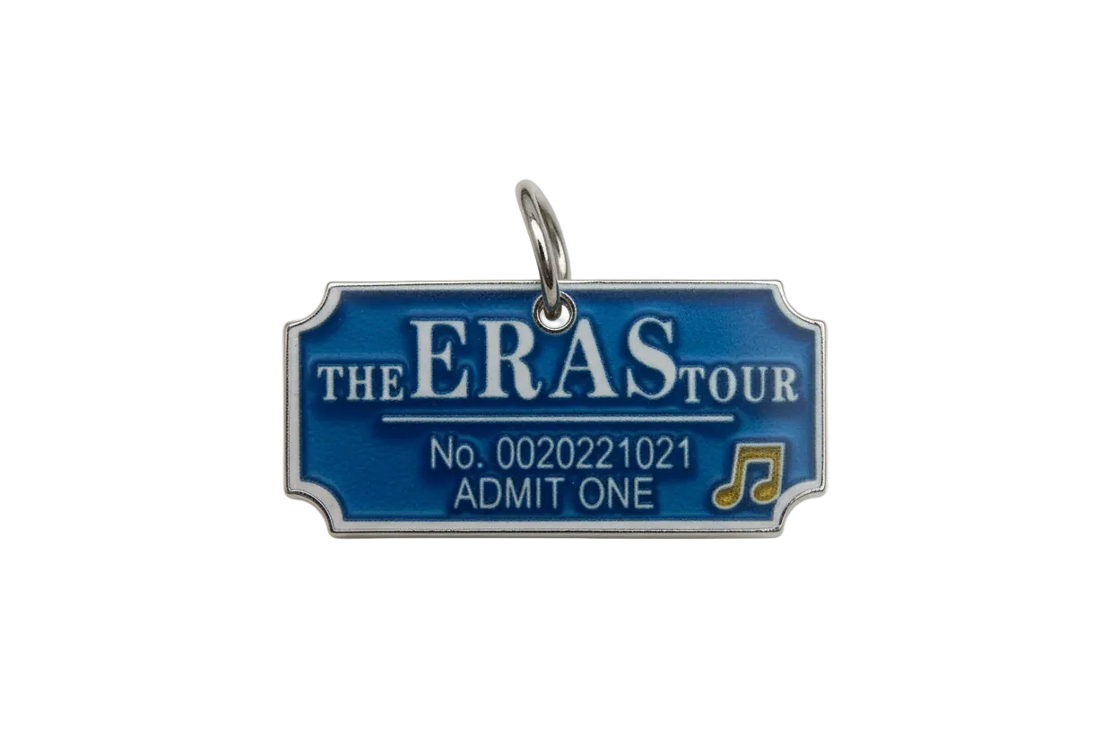 Glossy blue concert ticket with white lettering and a small gold music note detail
