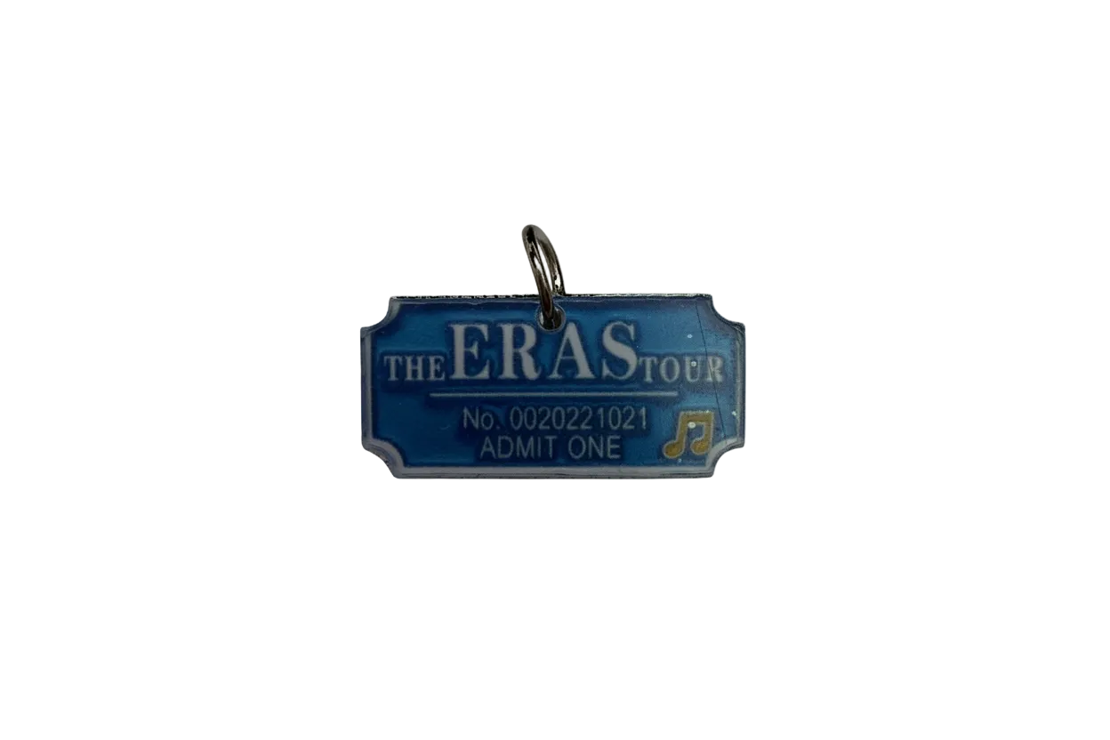 Blue concert ticket with white lettering and gold music note
