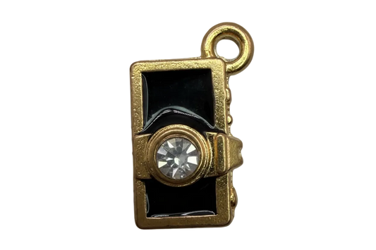 Gold camera charm with glossy black enamel and clear faceted crystal lens