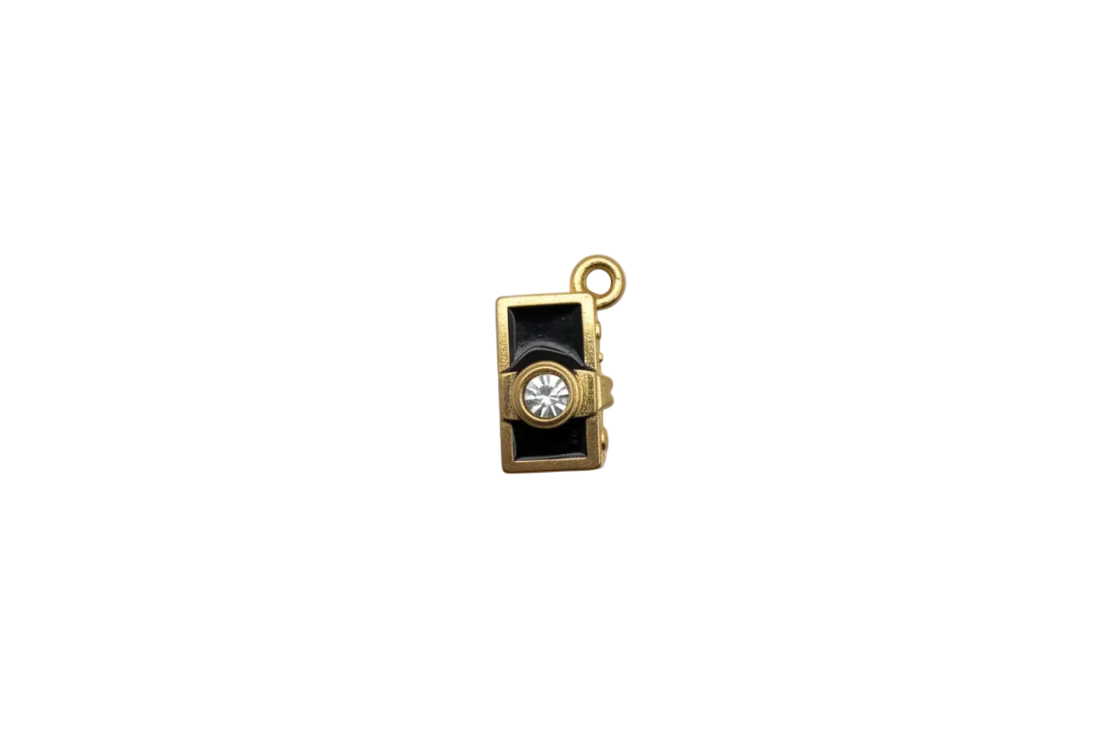 Gold camera with black enamel and clear faceted crystal