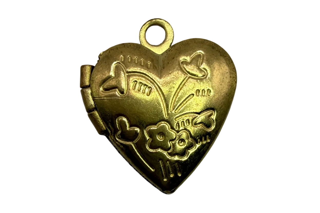Gold heart locket with raised floral and star engravings and a satin finish