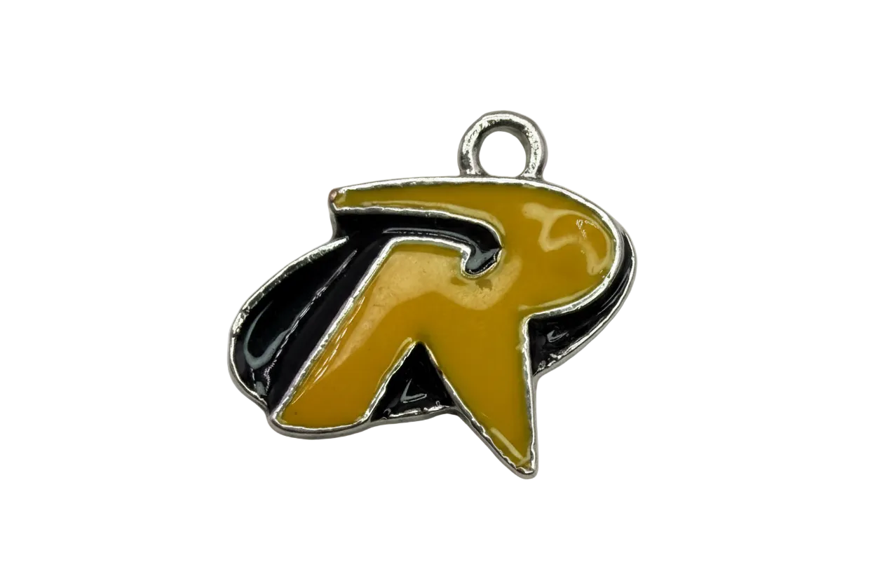 Mustard-yellow enamel letter R charm with black shadow and silver outline