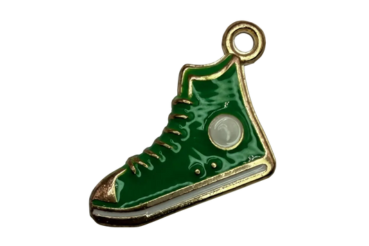Glossy green high-top sneaker charm with gold outline and white patch