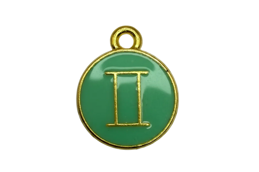 Green enamel round disc with gold outline and Gemini symbol
